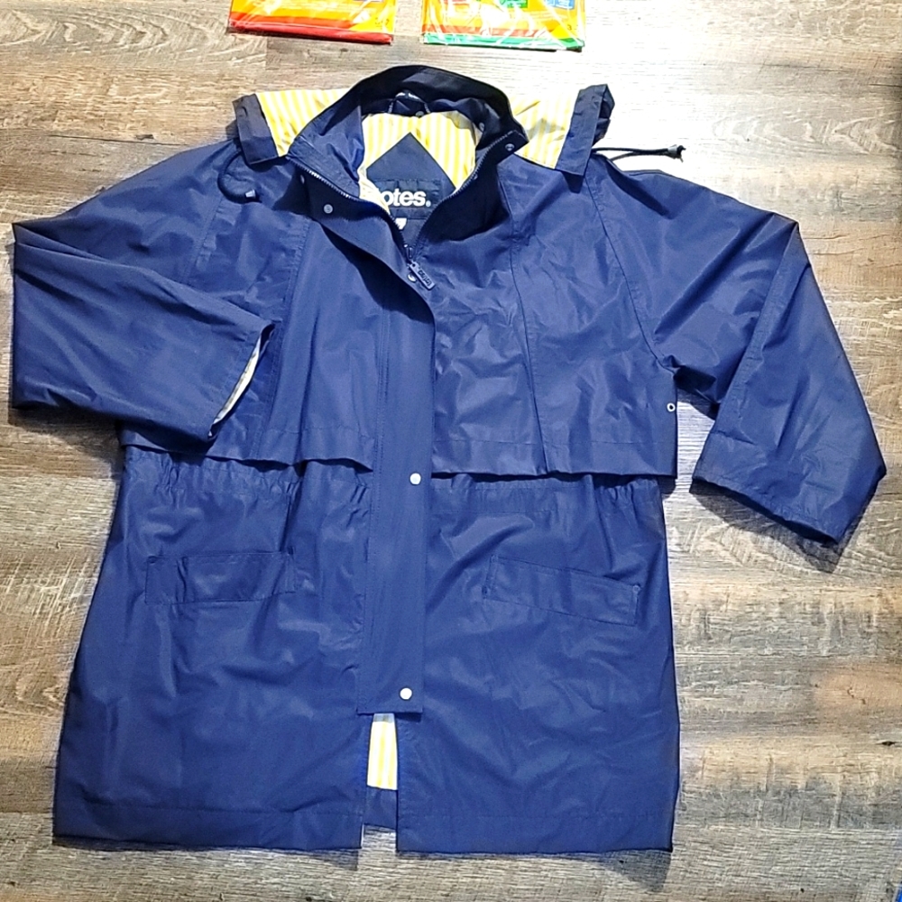 ONLY USED once or twice LIKE NEW  adult XL rain jacket by TOTES with hood, lined